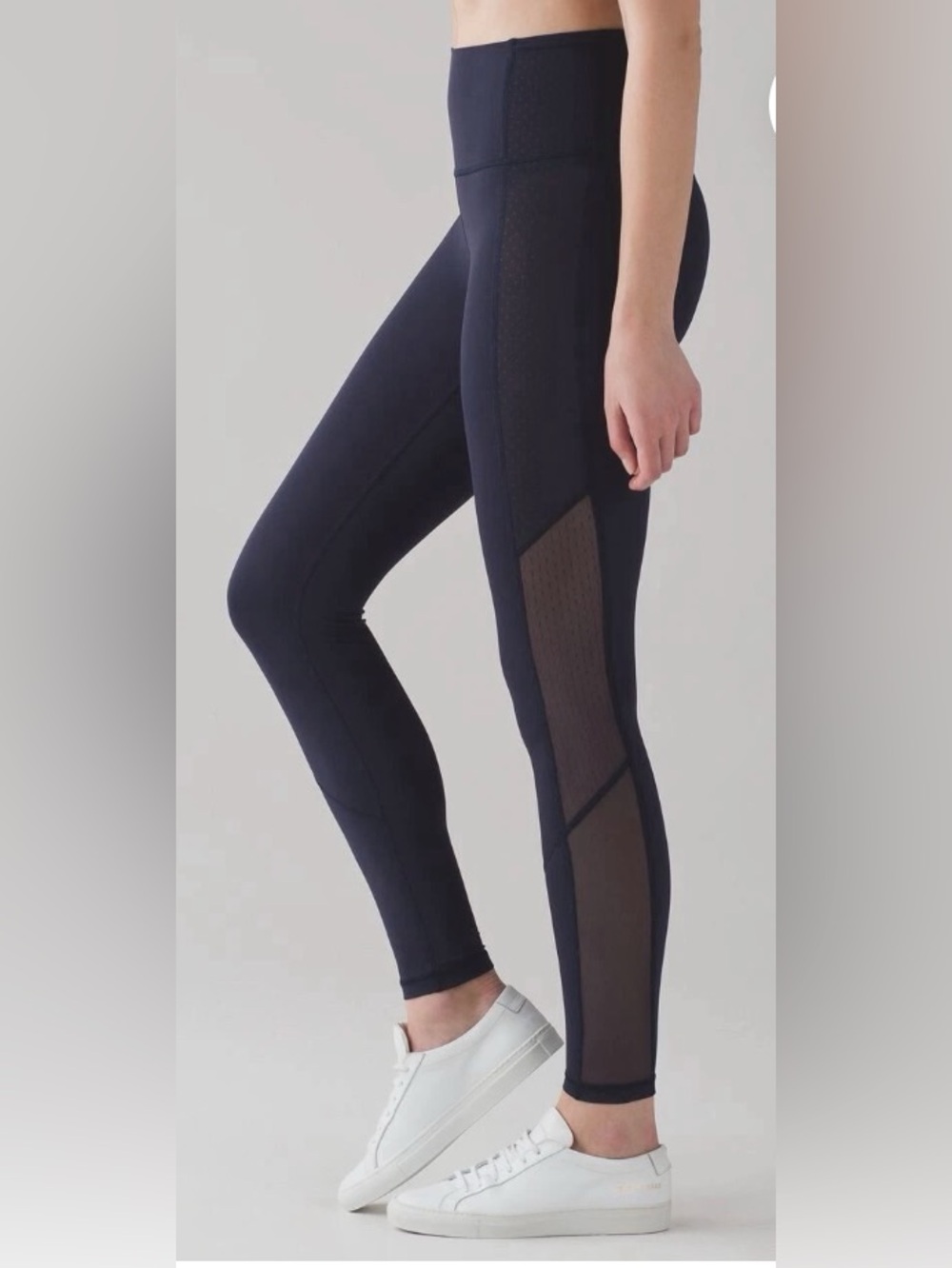 Blue Lululemon legging with mesh detailing on the side
